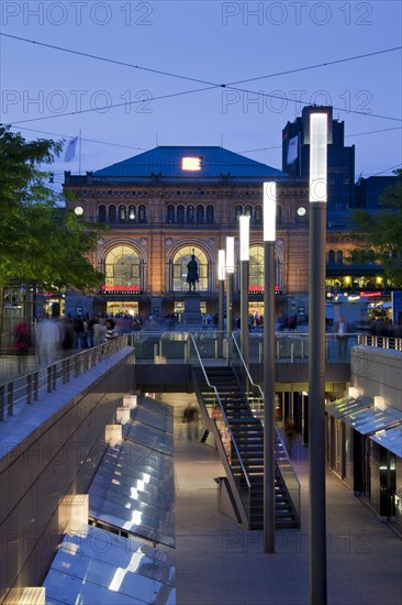 The Niki-de-Saint-Phalle-Promenade leading to the Central railway station in Hannover at sunset