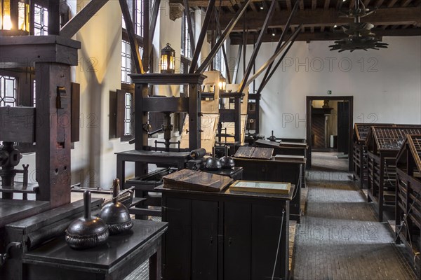 Print shop showing 18th century type cases and 17th century printing presses in the Plantin-Moretus Museum