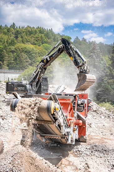 Black Liebherr crawler excavator recycling on demolition site