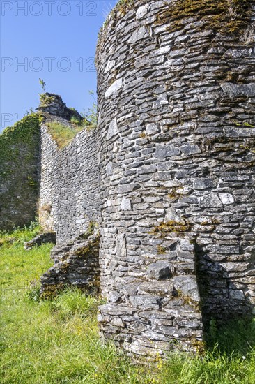 Buttresses on stone outer wall of 13th century Chateau d'Herbeumont