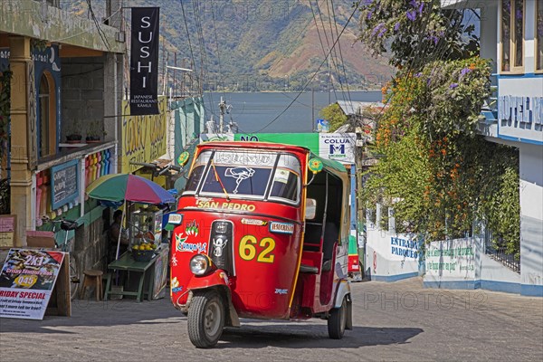 Red coloured tuk-tuk