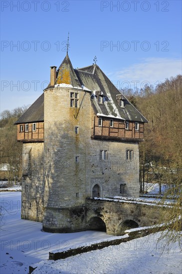 13th Century keep of Castle Carondelet at Crupet in the snow in winter