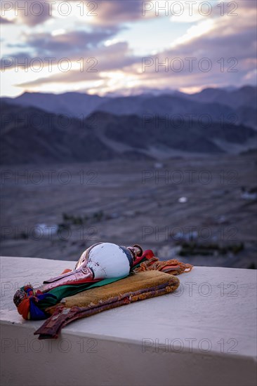 Blowing conch at Spituk Monastery