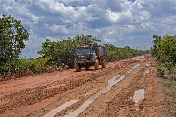 4x4 truck riding along the muddy Linden-Lethem dirt road linking Lethem and Georgetown in the rainy season