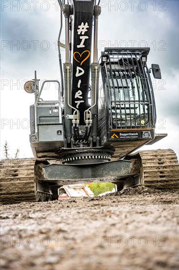 Black Liebherr crawler excavator recycling on demolition site