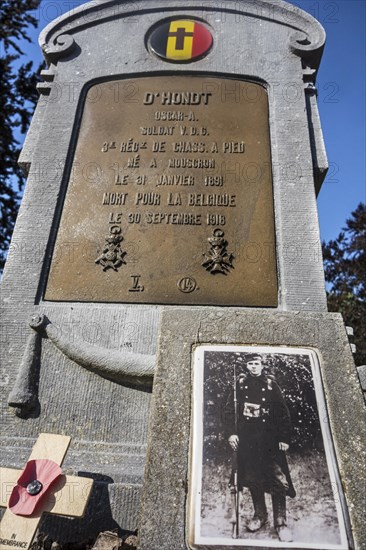 First World War One grave with photo of fallen soldier at the Belgian Military Cemetery at Houthulst