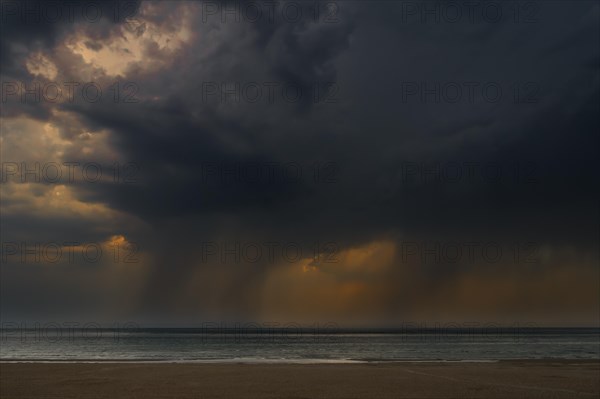 Thunderstorm showing dark rain clouds and cloudburst