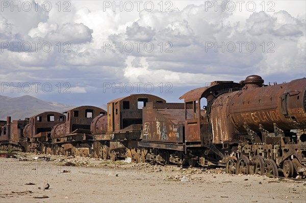 Rusty locomotive engines at cemetery of trains near Uyuni