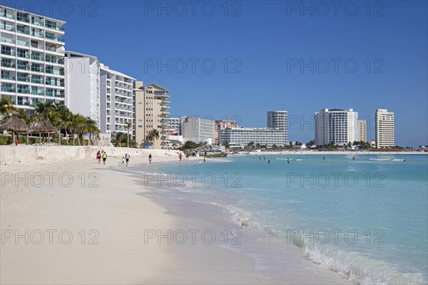 White sandy beach and highrise hotels along Caribbean Sea at the city Cancun in Mexican state Quintana Roo