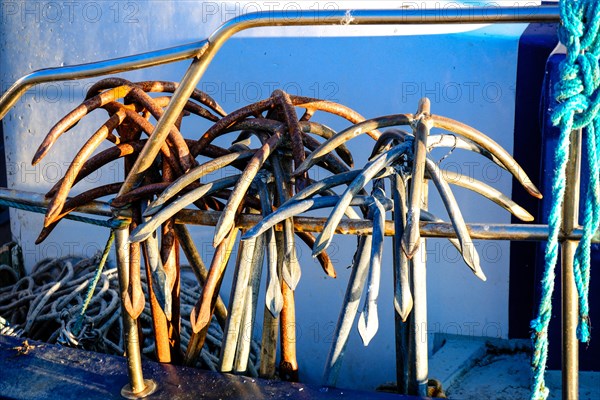 Metal anchors for fishing nets on a fishing cutter