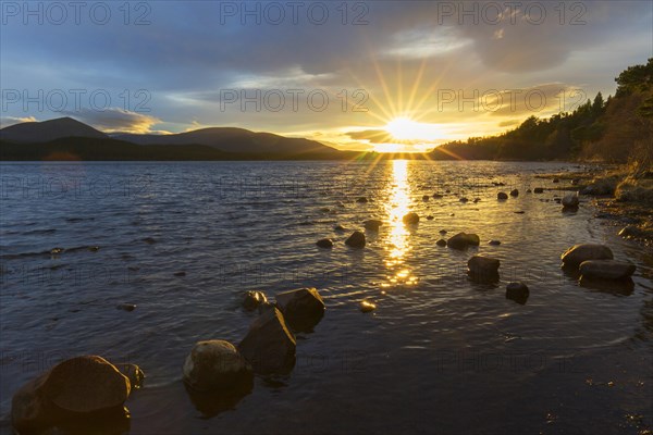 Loch Morlich and Cairngorm Mountains at sunset