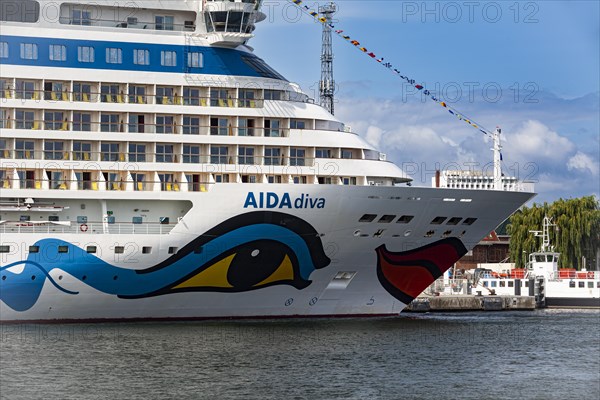 The cruise ship AIDADiva at the quay wall of the Warnemuende Cruise Center in the port of Rostock-Warnemuende