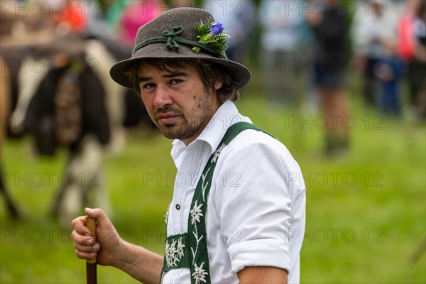 Alpine herdsman on the pasture