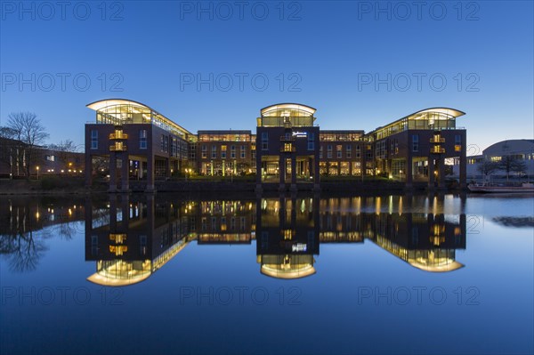 Radisson Blu Senator Hotel along the river Trave at sunset