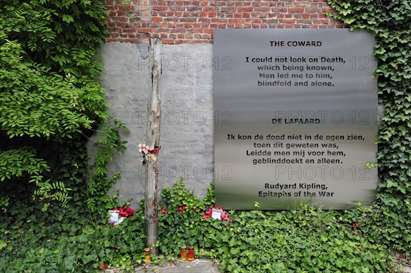 World War One execution pole and epitaph The Coward by Rudyard Kipling at inner courtyard of the Poperinge town hall