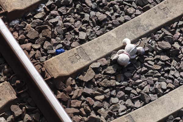 Plush animal in a railway bed