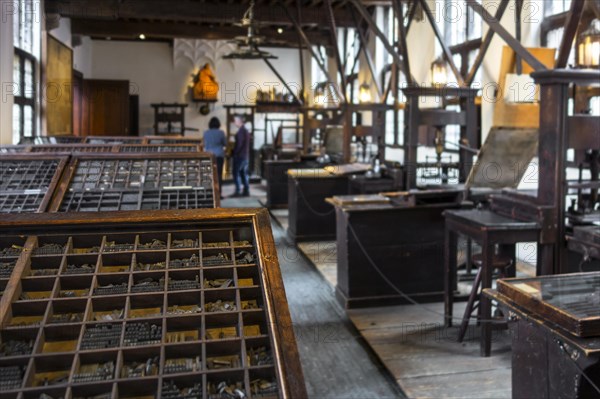 Print shop showing 18th century type cases and 17th century printing presses in the Plantin-Moretus Museum