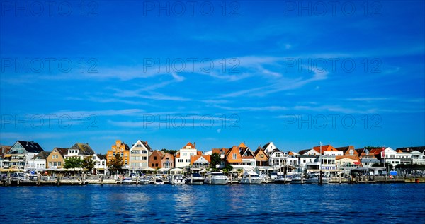 Front row commercial buildings and gastronomy in Travemuende on the river Trave. Hanseatic City of Luebeck. Schleswig-Holstein. Germany