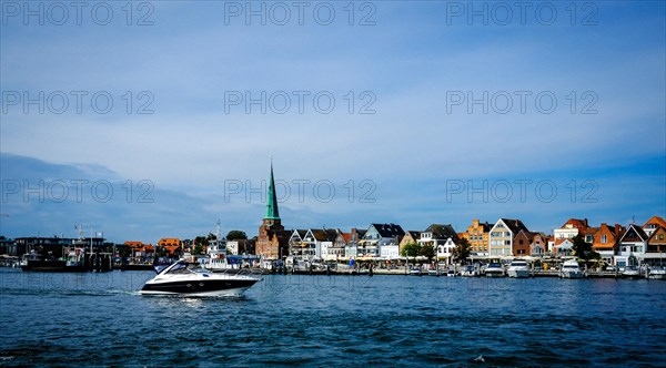 Trave with front rows of houses in Travemuende at the harbour. Hanseatic City of Luebeck