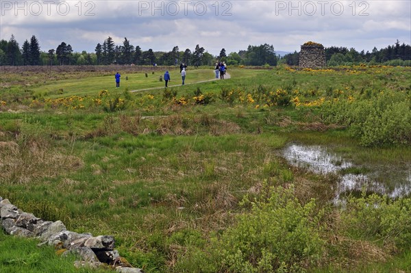 Tourists visiting the moor with its memorial cairn at the Culloden battlefield