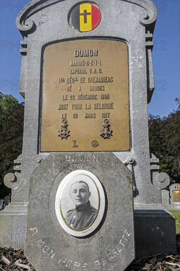 First World War One grave with photo of fallen soldier at the Belgian Military Cemetery at Houthulst