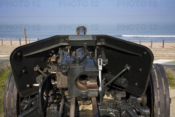 Cannon pointing towards the North Sea at the open-air museum Atlantic Wall at Raversijde