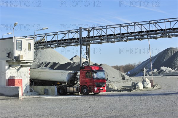 Truck and conveyer belt at porphyry quarry