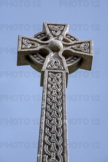 Monument with Celtic cross commemorating the Massacre of the Clan MacDonald of Glencoe in 1692