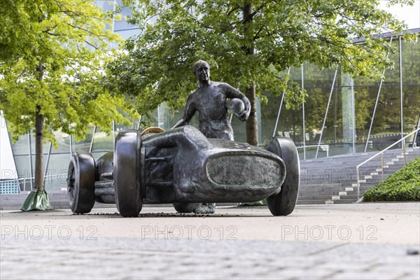 Monument in front of the Mercedes-Benz Museum commemorates the legendary racing driver Juan Manuel Fangio in his 1954 Silver Arrow W 196 R