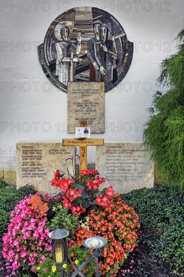 Gravestone with floral decoration and mosaic