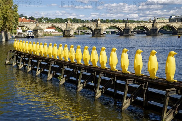Yellow penguins by the Cracking Art Group at Museum Kampa