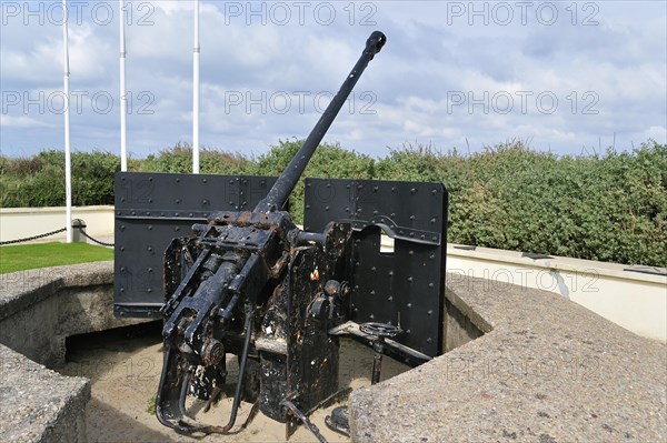 Second World War Two German anti-aircraft gun near the WW2 Utah Beach Landing Museum at Sainte-Marie-du-Mont