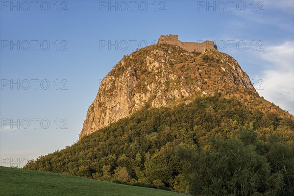 Ruins of the medieval Chateau de Montsegur castle on hilltop at sunset