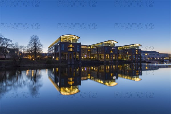 Radisson Blu Senator Hotel along the river Trave at sunset