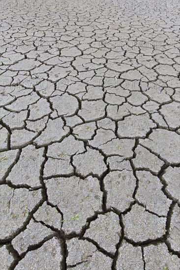 Abstract pattern of dry cracked clay mud in dried up lake bed