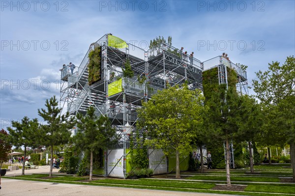 Viewing platform on a metal scaffolding overgrown with green plants at the Federal Horticultural Show