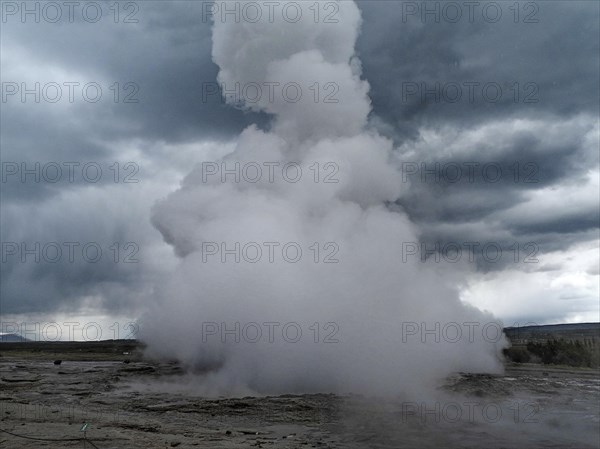 The geyser Stokkur in the hot water valley Haukadalur in the municipality of Blaskogabyggd in the south of Iceland