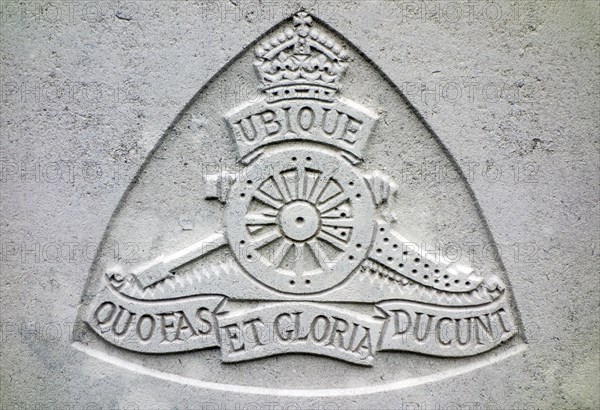 Royal Field Artillery regimental badge on headstone at Cemetery of the Commonwealth War Graves Commission for First World War One British soldiers