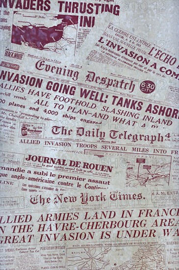 Memorial stone with frontpages of newspapers during D-Day at the Juno Beach Centre at Courseulles-sur-Mer