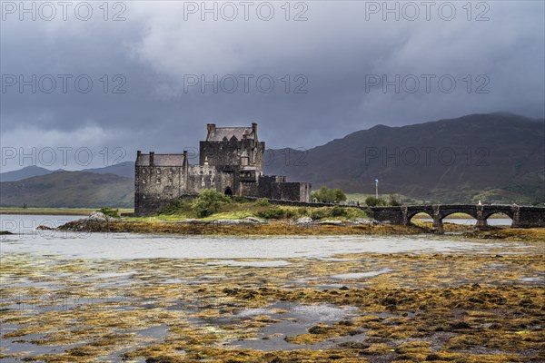 Eilean Donan Castle in Loch Duich during rain shower