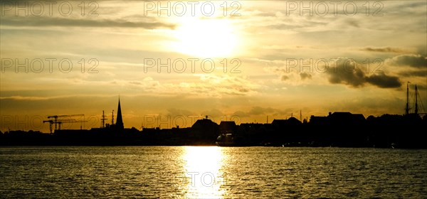 City skyline of Travemuende at sunset. Hanseatic City of Luebeck