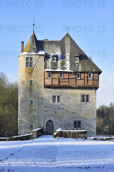 13th Century keep of Castle Carondelet at Crupet in the snow in winter