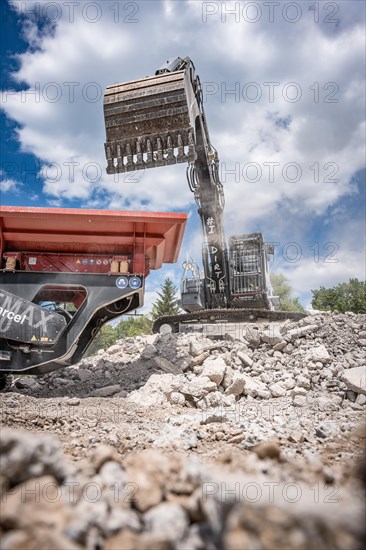 Black Liebherr crawler excavator for demolition recycling on construction site