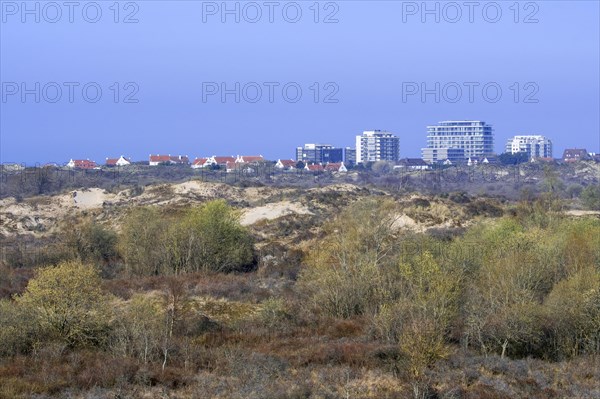 Flats and villas of seaside resort De Panne behind the sand dunes of nature reserve De Westhoek