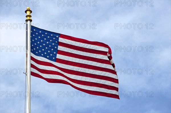 American flag showing US Stars and Stripes blowing in the wind
