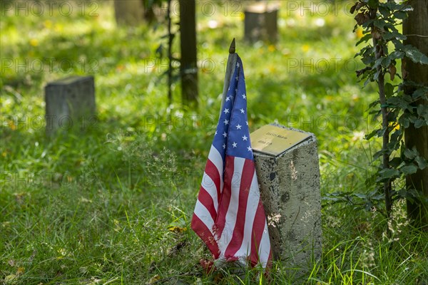 American flag at commemoration stone for fallen soldier at Bois de la Paix