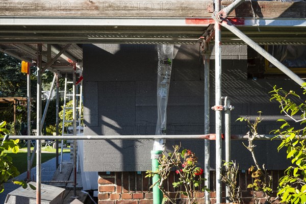 Insulation of a brick house facade with Polystorol insulation boards in Hilden