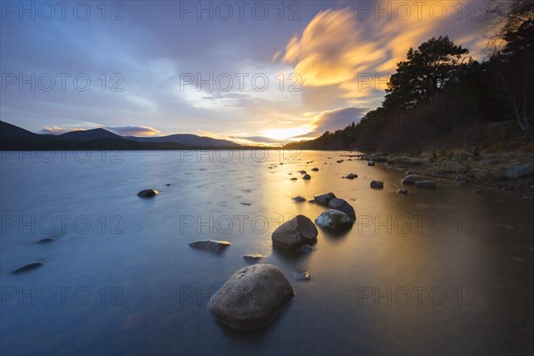 Loch Morlich and Cairngorm Mountains at sunset