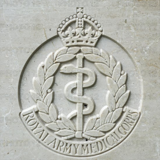 Royal Army Medical Corps regimental badge on headstone at Cemetery of the Commonwealth War Graves Commission for First World War One British soldiers