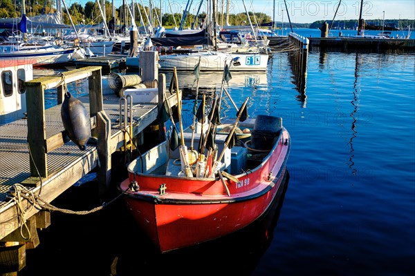 Small boat at a jetty in Travemuende harbour. Schleswig-Holstein